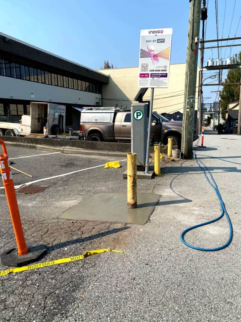 A repaired concrete slab in a parking lot