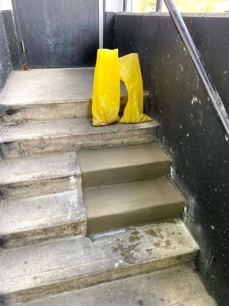Fresh and wet concrete steps is shown.
